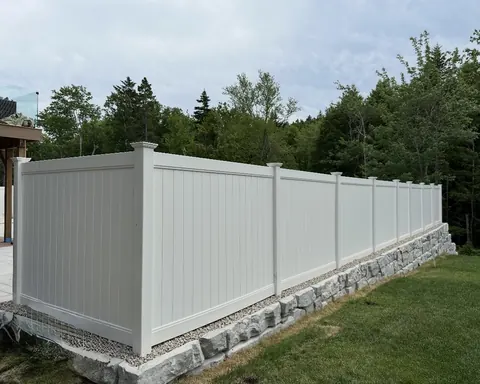 Black chain-link fence along a commercial property